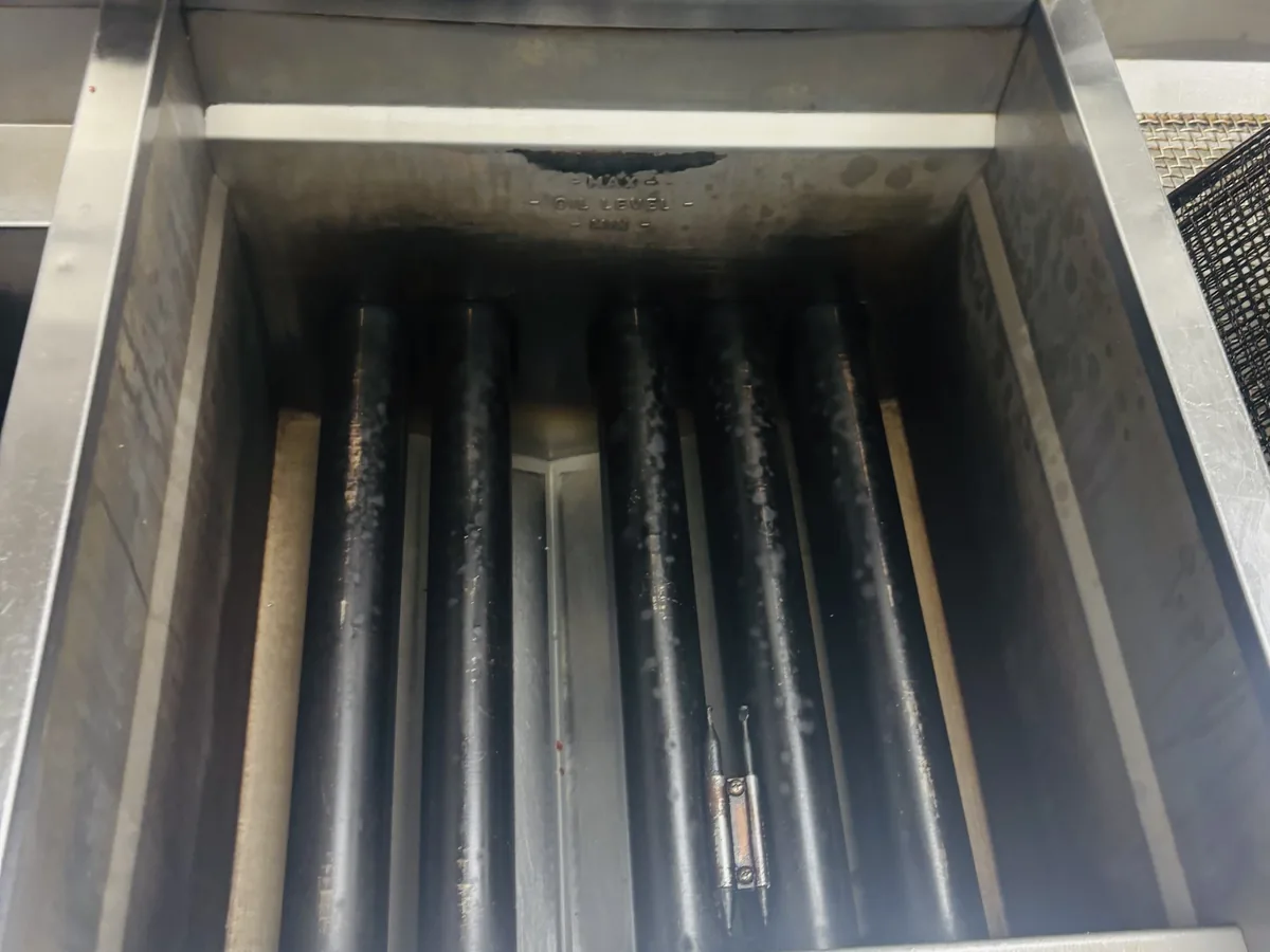 The same hood grease trough cleaned to bare stainless steel by ARC